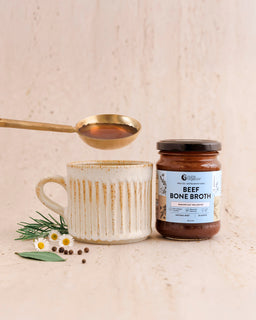 Beef Bone Broth Natural Nutra Organics product next to a mug