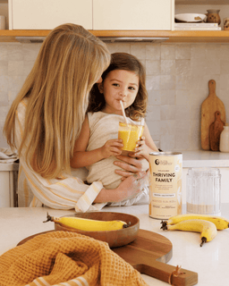 Mother and child drinking banana smoothie made with Thriving Family Unflavoured
